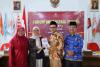 ketua  Bawaslu Kabupaten Pasaman  (Rini Juita) dalam memperkenalkan program Coaching Clinic dalam  Forum Konsultasi Publik (FKP) KPU Kabupaten Pasaman